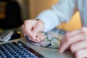 man working late to prepare for interview