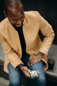 Man on phone coping with pandemic grief