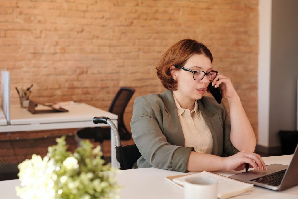 woman in wheelchair, working from home is another of the pandemic positives