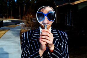 looking carefully - through magnifying glass