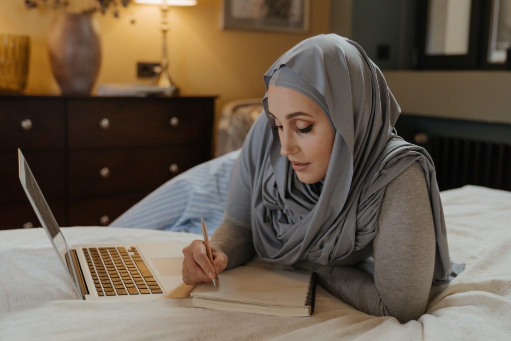 Muslim woman working at home