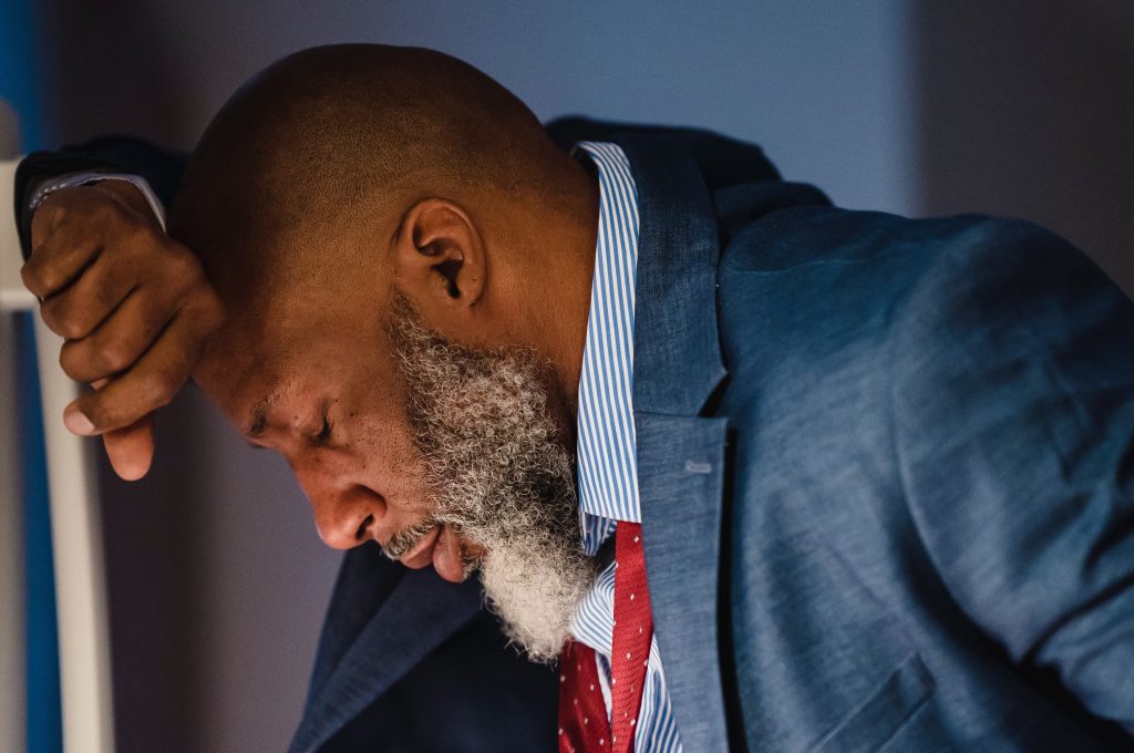 black man is a very unhappy employee