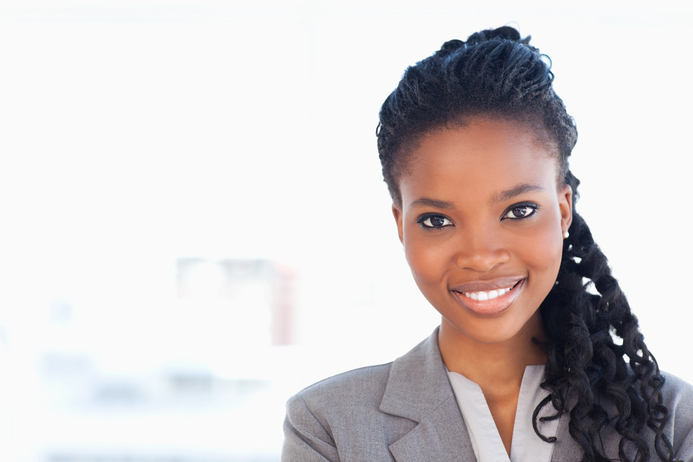 Black gen-z female employee in grey suit