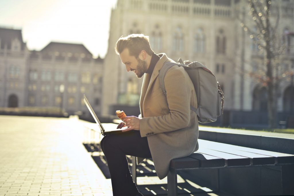 Man reading AudioBlog outside