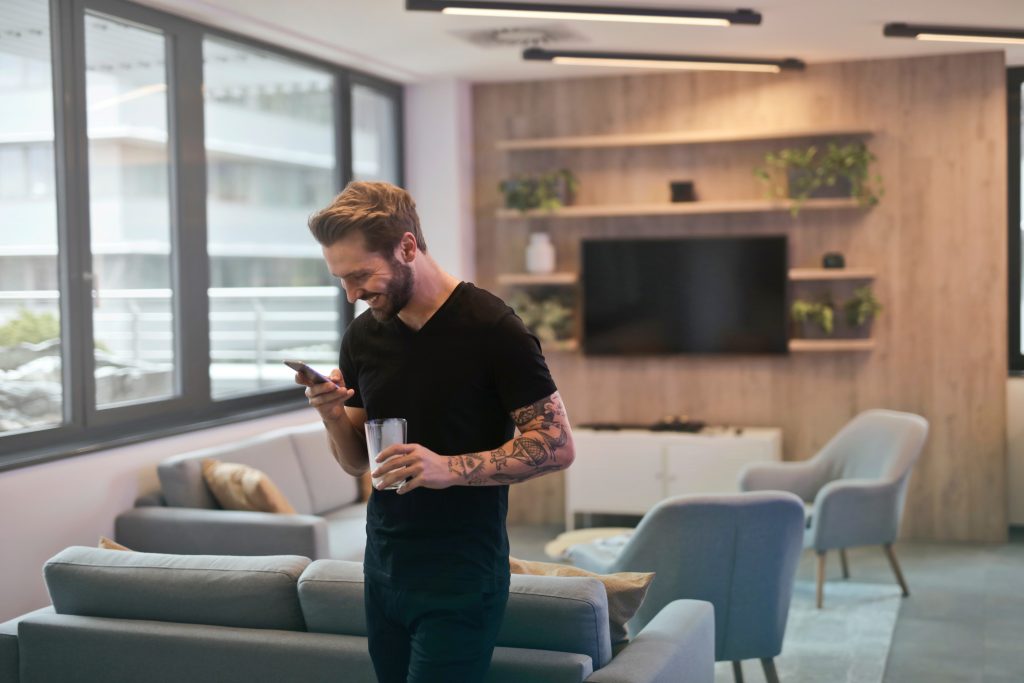 Man with tattoos reads during break from work