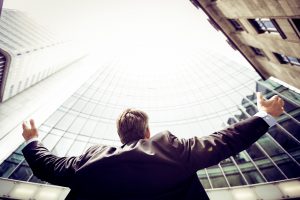 man excited after overcoming workplace obstacles