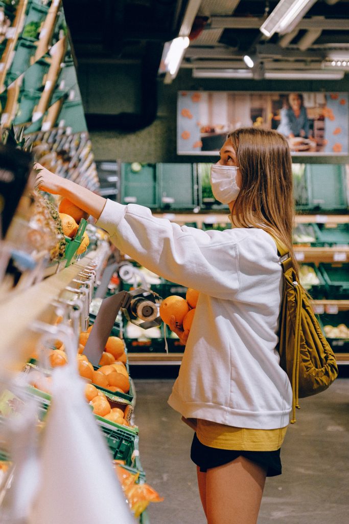 woman shopping despite pandemic grief